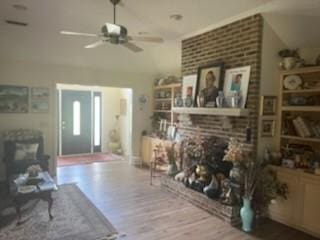 3042 Charing Cross Cross, Brunswick, GA 31525 - living room featuring wood finished floors, ceiling fan, and a fireplace