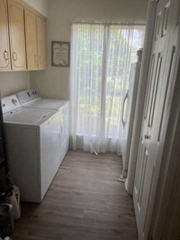 3042 Charing Cross Cross, Brunswick, GA 31525 - washroom with washing machine and dryer, wood finished floors, and cabinet space