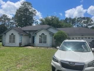 3042 Charing Cross Cross, Brunswick, GA 31525 - single story home featuring a front yard and a garage