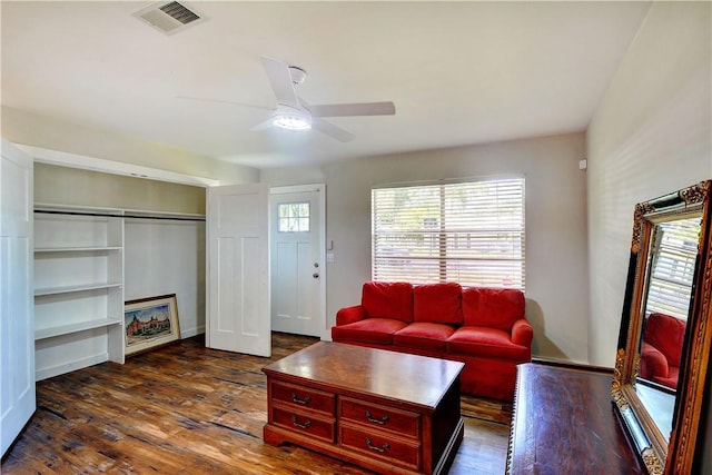 828 Lee St, Brunswick, GA 31520 - living area featuring a ceiling fan and dark wood-style floors