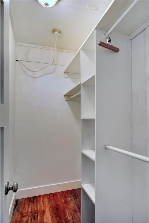 828 Lee St, Brunswick, GA 31520 - walk in closet featuring dark wood-type flooring