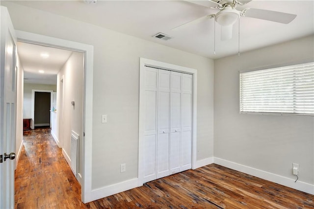 828 Lee St, Brunswick, GA 31520 - unfurnished bedroom featuring a closet, dark wood-type flooring, and ceiling fan