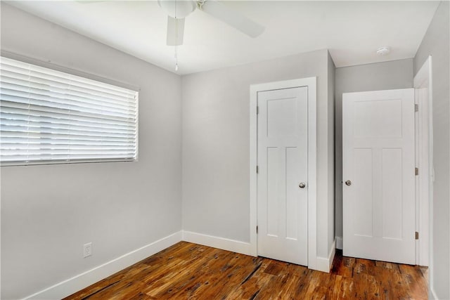 828 Lee St, Brunswick, GA 31520 - unfurnished bedroom with wood finished floors, a ceiling fan, and a closet