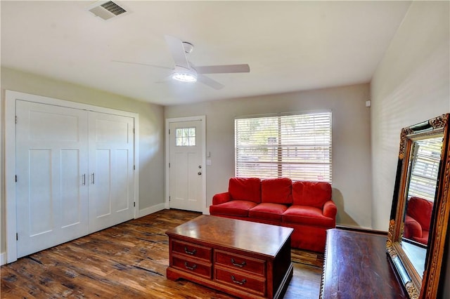 828 Lee St, Brunswick, GA 31520 - living room with dark wood-style floors and a ceiling fan