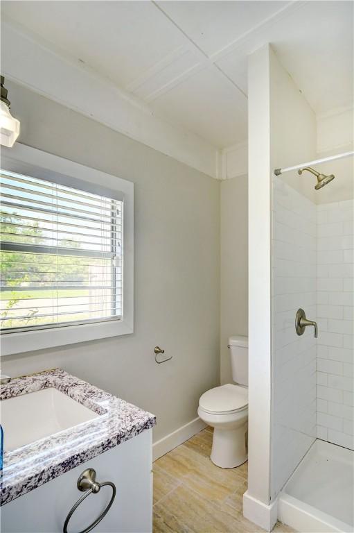 828 Lee St, Brunswick, GA 31520 - bathroom featuring a stall shower, wood finished floors, and vanity