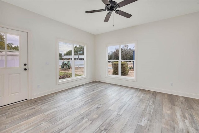 interior space featuring light hardwood / wood-style floors and ceiling fan