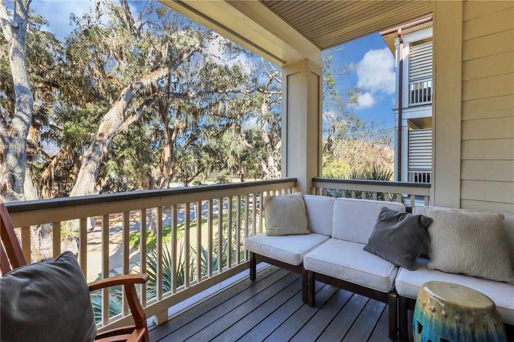 wooden terrace featuring an outdoor living space