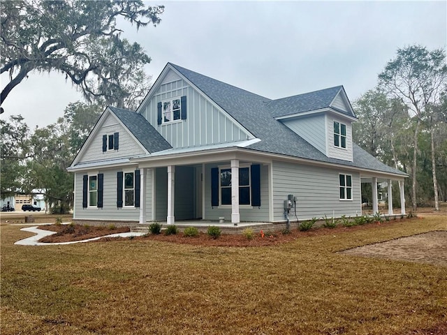 view of front facade with a front lawn and a porch