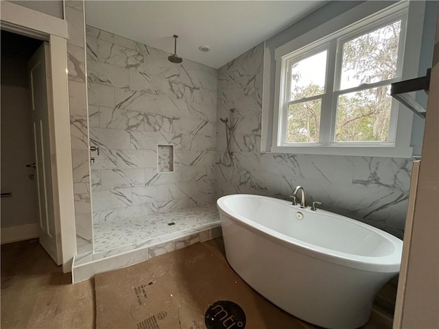 bathroom with shower with separate bathtub, hardwood / wood-style floors, and tile walls