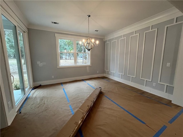 unfurnished dining area featuring crown molding and a notable chandelier