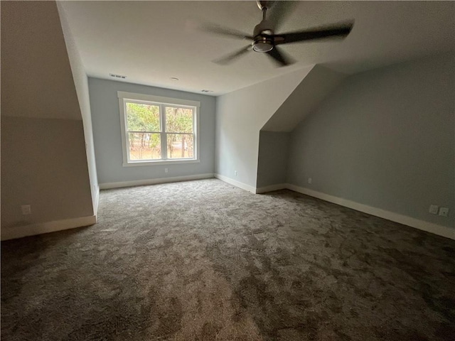 additional living space featuring vaulted ceiling, ceiling fan, and carpet