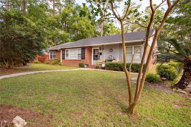 1405 Grove Ave, Waycross, GA 31501 - ranch-style house with a front yard and brick siding