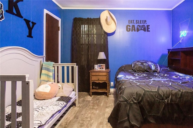 1405 Grove Ave, Waycross, GA 31501 - bedroom with wood finished floors and crown molding
