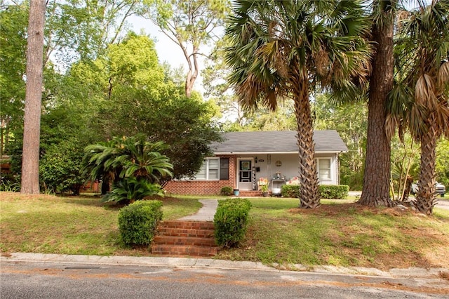 1405 Grove Ave, Waycross, GA 31501 - view of front of house with a front lawn and brick siding
