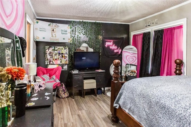 1405 Grove Ave, Waycross, GA 31501 - bedroom featuring crown molding, a textured ceiling, and wood finished floors