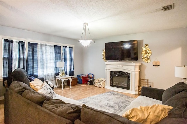 1405 Grove Ave, Waycross, GA 31501 - living area featuring wood finished floors and a high end fireplace