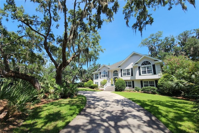 412 Palm Dr, Saint Simons Island, GA 31522 - split foyer home with a front lawn and driveway