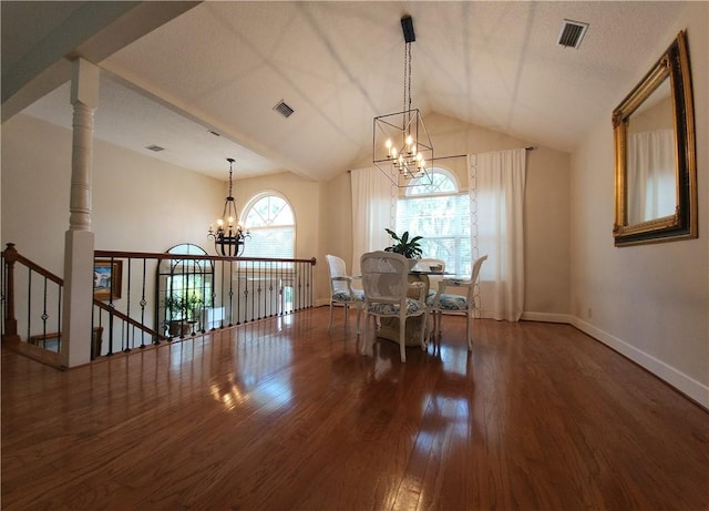 412 Palm Dr, Saint Simons Island, GA 31522 - dining area with a chandelier, wood finished floors, and vaulted ceiling