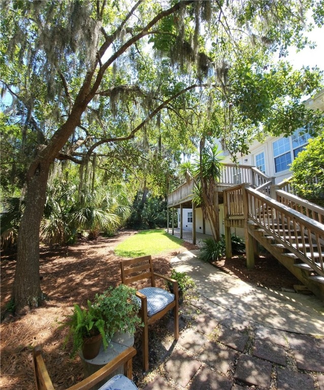 412 Palm Dr, Saint Simons Island, GA 31522 - view of yard featuring stairs and a patio