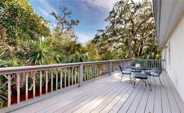 412 Palm Dr, Saint Simons Island, GA 31522 - wooden terrace featuring outdoor dining space