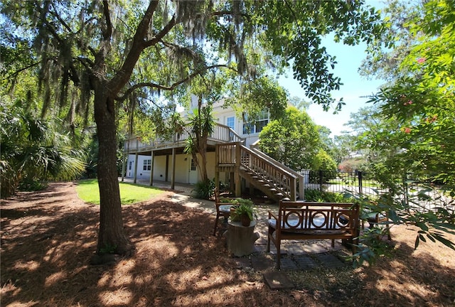412 Palm Dr, Saint Simons Island, GA 31522 - rear view of house featuring stairway