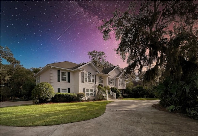 412 Palm Dr, Saint Simons Island, GA 31522 - view of front facade featuring a yard and driveway
