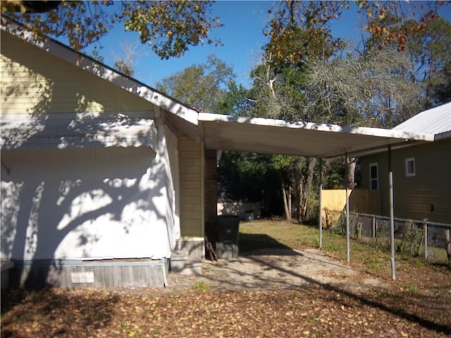 view of property exterior featuring a carport