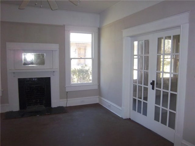 unfurnished living room featuring french doors