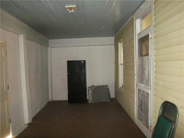 hallway with wood walls