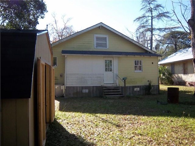 back of house with a yard