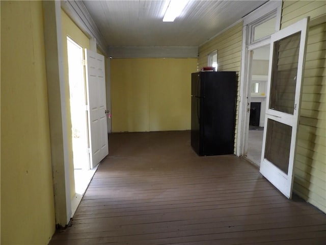 corridor with wood-type flooring