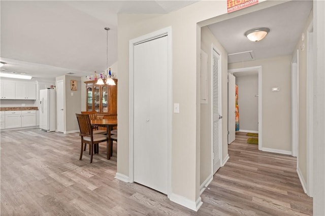 127 Landover Dr, Brunswick, GA 31525 - corridor with attic access, light wood-style floors, and baseboards