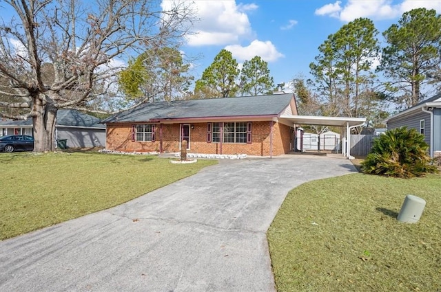 ranch-style home with a front lawn and a carport