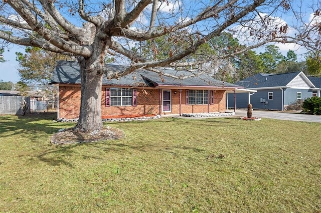 ranch-style home featuring a front yard