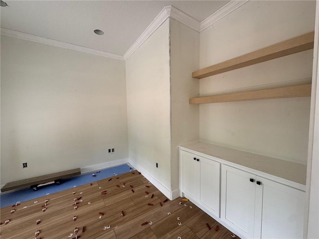 701 Broadwood Dr, Woodbine, GA 31569 - unfurnished room with ornamental molding and dark wood-style flooring