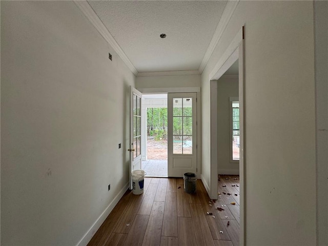 701 Broadwood Dr, Woodbine, GA 31569 - doorway to outside featuring ornamental molding, dark wood-style flooring, and a textured ceiling