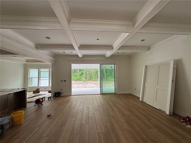 701 Broadwood Dr, Woodbine, GA 31569 - unfurnished living room with coffered ceiling, beam ceiling, wood finished floors, and crown molding