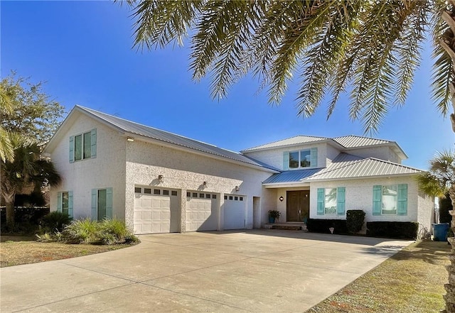 view of front of property with a garage