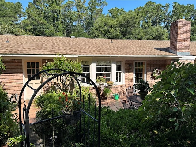 rear view of house with a patio