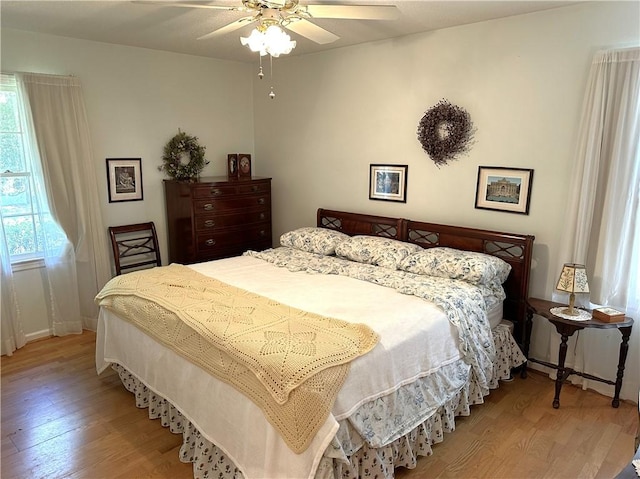 bedroom featuring ceiling fan and light hardwood / wood-style floors