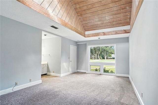 422 Fairway Villas Dr, Saint Simons Island, GA 31522 - carpeted spare room featuring wooden ceiling and a raised ceiling