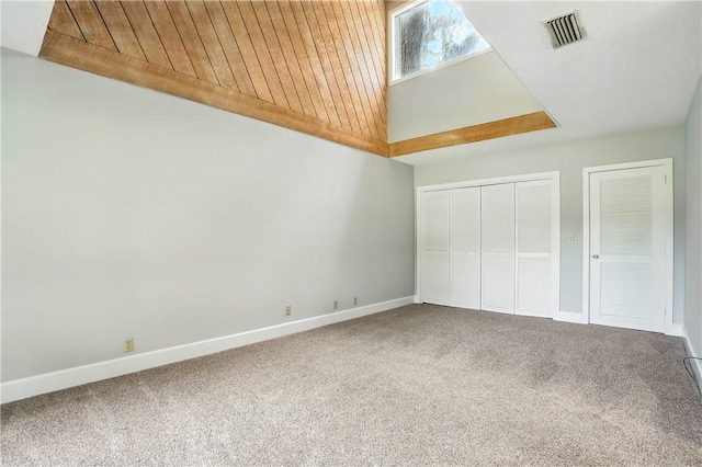 422 Fairway Villas Dr, Saint Simons Island, GA 31522 - unfurnished bedroom featuring carpet flooring, wooden ceiling, and high vaulted ceiling