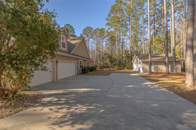 view of side of property with a garage