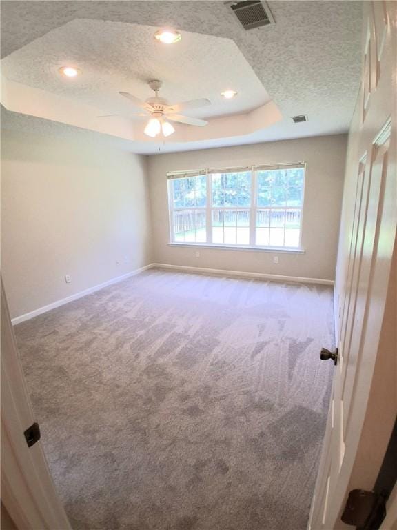 43 Shadowlake Ct, Brunswick, GA 31525 - carpeted empty room featuring a raised ceiling, a textured ceiling, ceiling fan, and recessed lighting