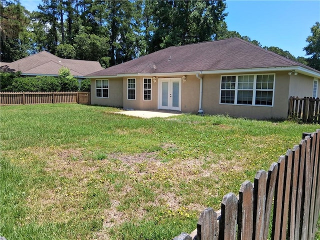43 Shadowlake Ct, Brunswick, GA 31525 - back of property with french doors, stucco siding, a patio, and a shingled roof