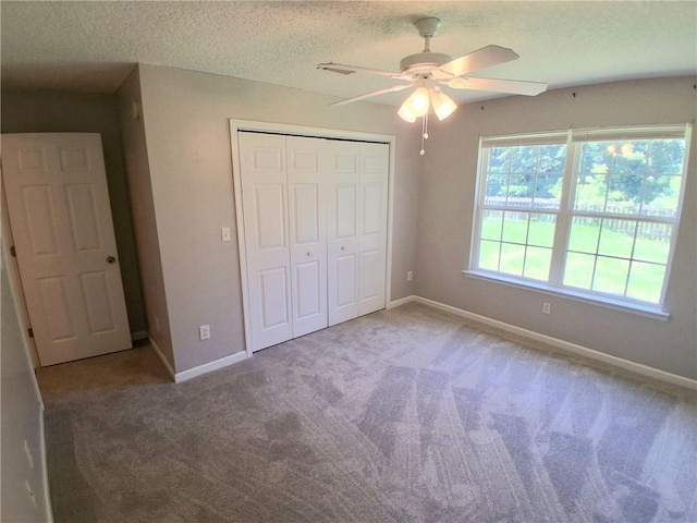 43 Shadowlake Ct, Brunswick, GA 31525 - unfurnished bedroom with a closet, carpet floors, a textured ceiling, and a ceiling fan