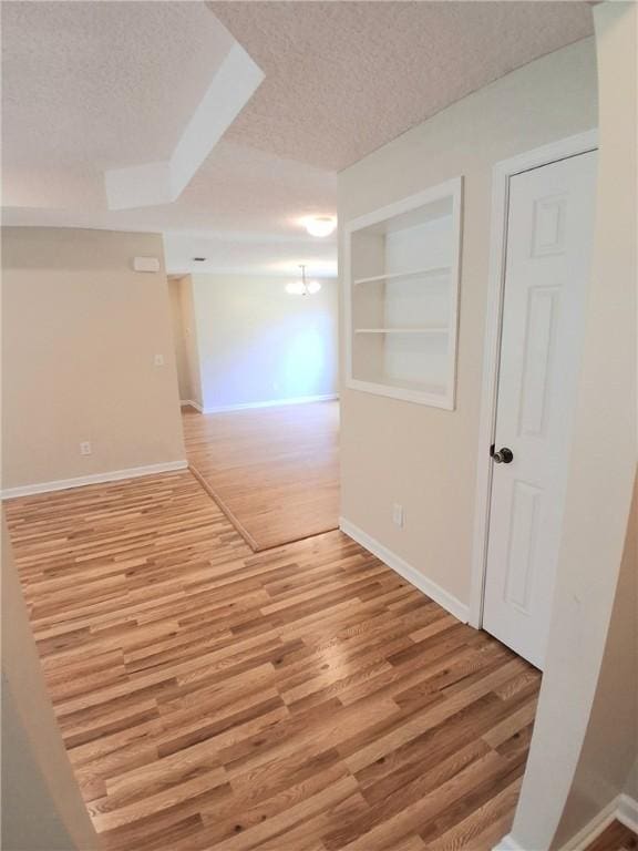 43 Shadowlake Ct, Brunswick, GA 31525 - empty room with light wood-style floors and a textured ceiling