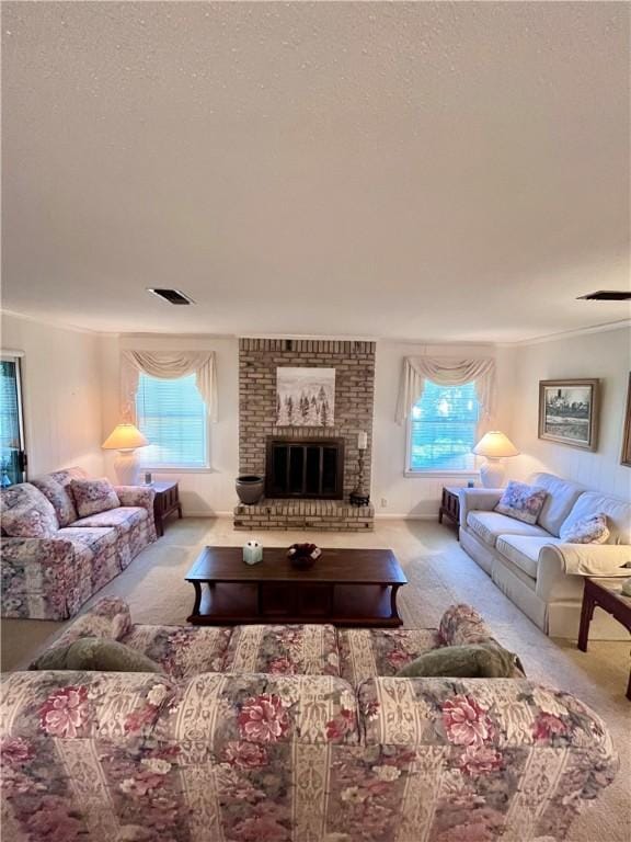 119 Saint Clair Dr, Saint Simons Island, GA 31522 - carpeted living area featuring plenty of natural light, a textured ceiling, a brick fireplace, and ornamental molding