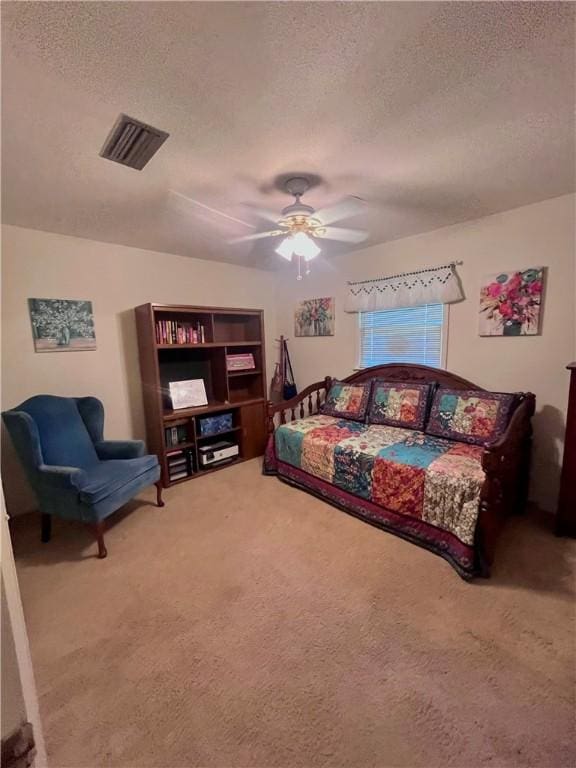 119 Saint Clair Dr, Saint Simons Island, GA 31522 - carpeted bedroom with a textured ceiling and ceiling fan