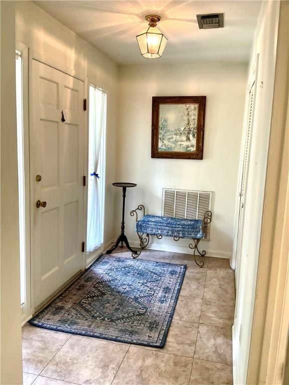 119 Saint Clair Dr, Saint Simons Island, GA 31522 - entrance foyer featuring tile patterned floors and baseboards